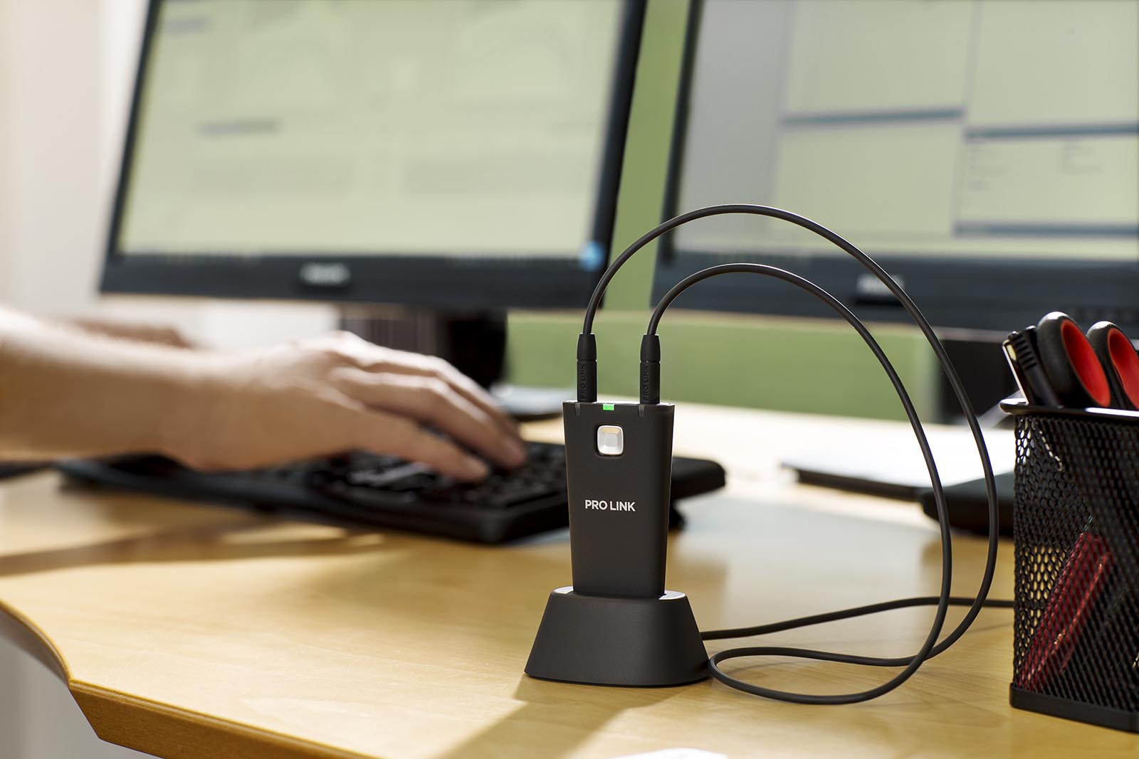 Pro Link wireless fitting device on office desk